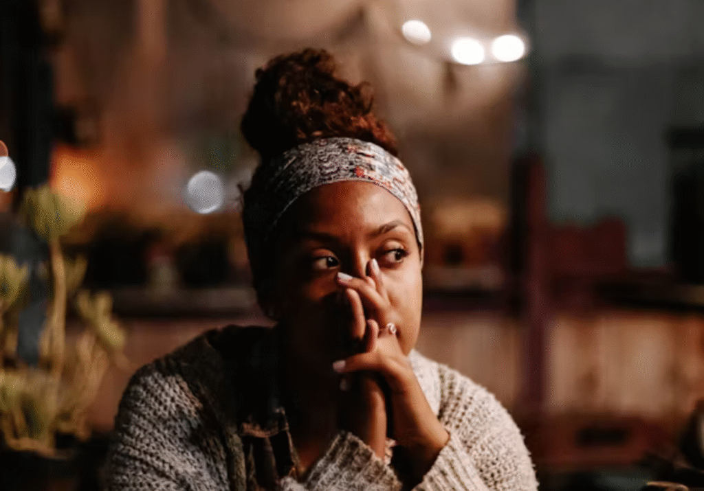 Woman sitting quietly in thought.