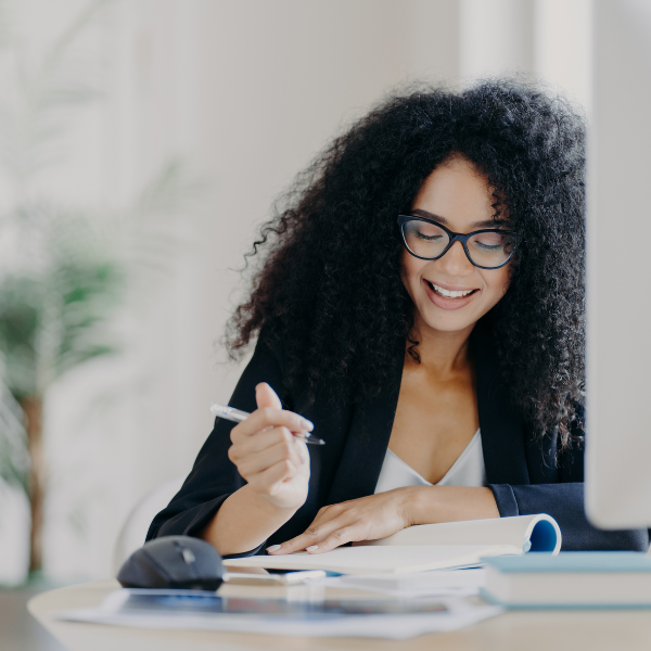 Woman Working Confidently at Her Desk